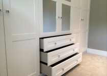 fitted wardrobe with mirror inserts and drawers